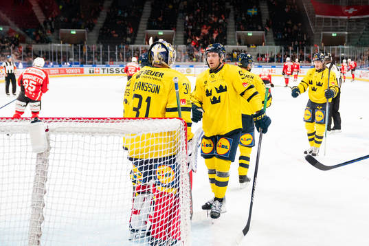 Goaltender Lars Johansson and Linus Sandin of Sweden