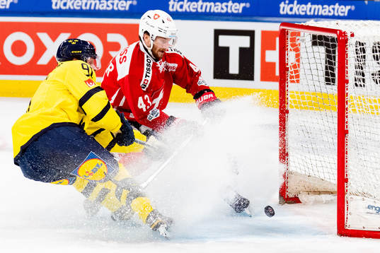 Jesper Olofsson of Sweden scores the 4-2 goal in the ice