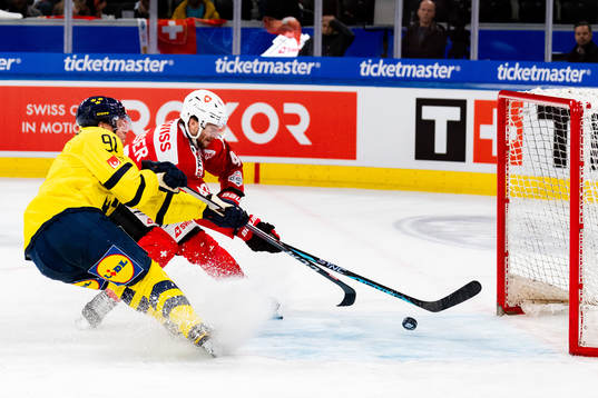 Jesper Olofsson of Sweden scores the 4-2 goal in the ice