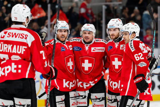 Andrea Glauser of Switzerland celebrates with teammates