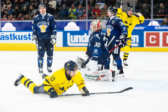 Andreas Wingerli of Sweden scores 1-1  in the ice hockey