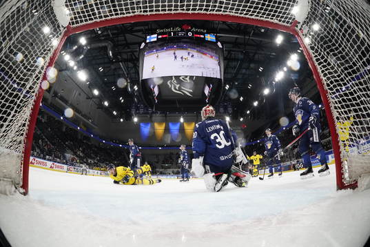 Andreas Wingerli of Sweden scores 1-1 in the ice hockey