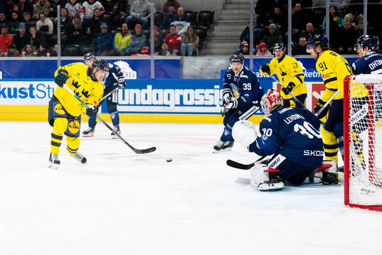 Marcus Sörensen of Sweden against goaltender Lassi