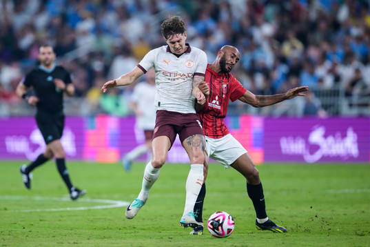John Stones of Manchester City and Jose Kante of Urawa Reds