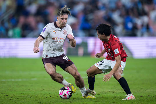 Jack Grealish of Manchester City and Kaito Yasui of Urawa