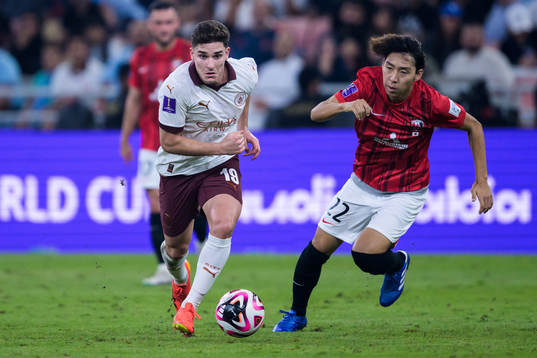 Julian Alvarez of Manchester City and Kai Shibato of Urawa