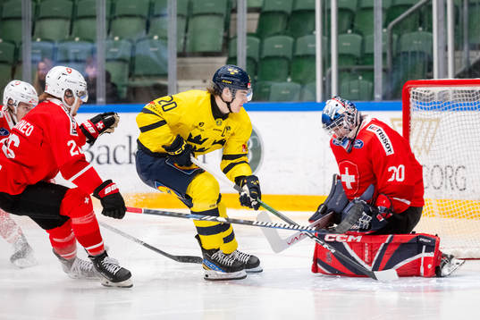 Liam Öhgren of Sweden against goaltender Ewan Huet of