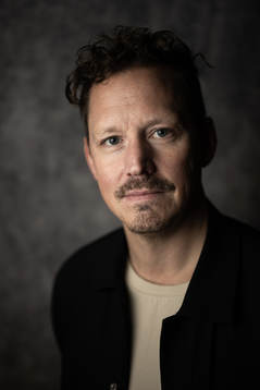 Fredrik Warg, studio Oddset poses for a portrait