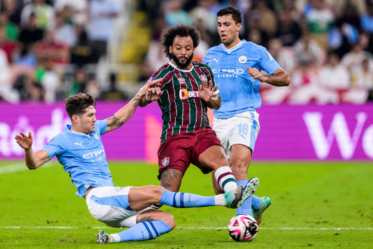 John Stones and Rodrigo of Manchester City and Marcelo of