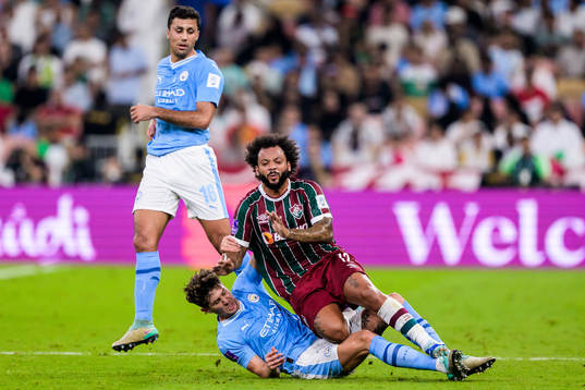 John Stones and Rodrigo of Manchester City and Marcelo of