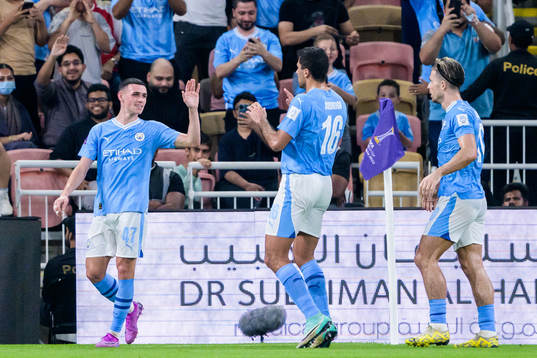 Phil Foden, Rodrigo, and Jack Grealish of Manchester City