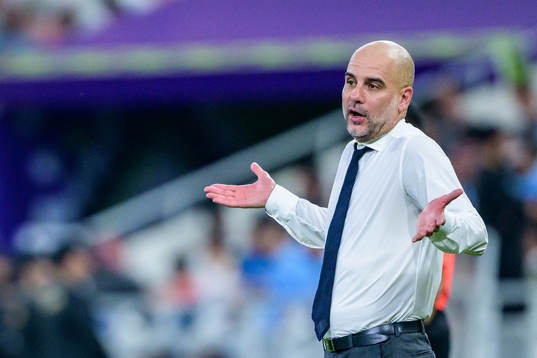 Jack Grealish and Head coach Pep Guardiola of Manchester