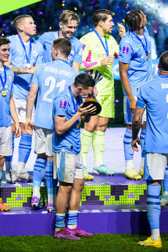 Phil Foden of Manchester City celebrates with the trophy