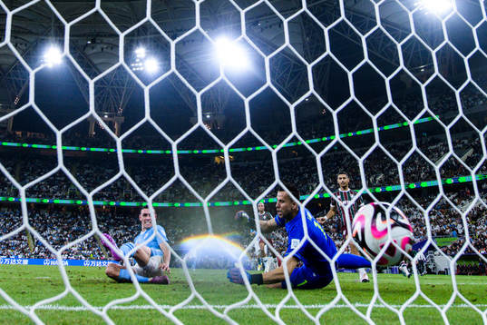 Phil Foden of Manchester City scores 0-3 behind goalkeeper