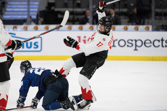 Jere Lassila of Finland and Macklin Celebrini of Canada