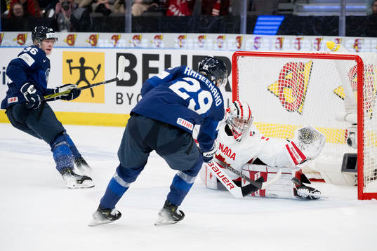 Goaltender Mathis Rousseau of Canada with a save
