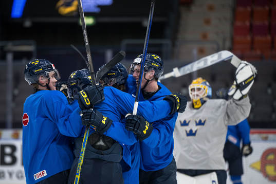 Players of Sweden celebrate at a practice session