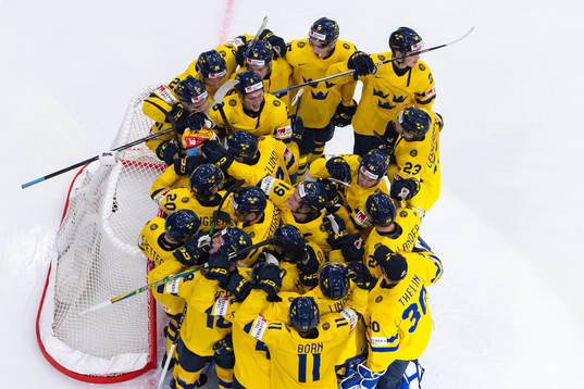 Goaltender Hugo Hävelid of Sweden celebrate with teammates