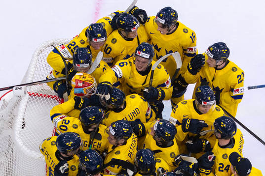 Goaltender Hugo Hävelid of Sweden celebrate with teammates