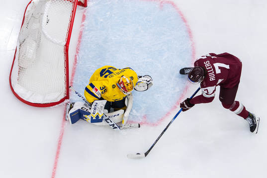 Goaltender Hugo Hävelid of Sweden and Rainers Rullers of