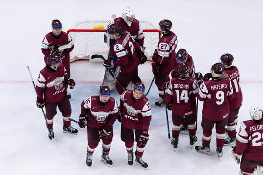 The players of Latvia looks dejected