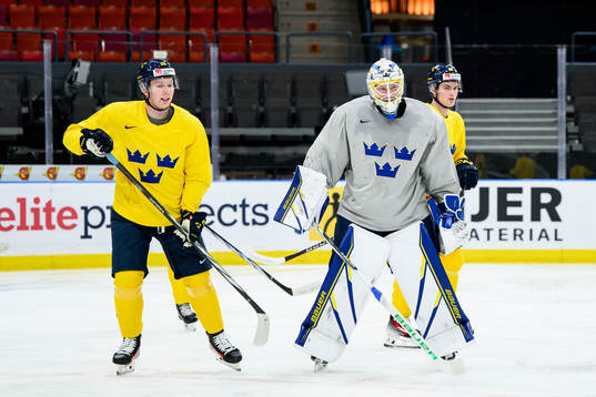 Otto Stenberg and goaltender Melker Thelin of Sweden at a