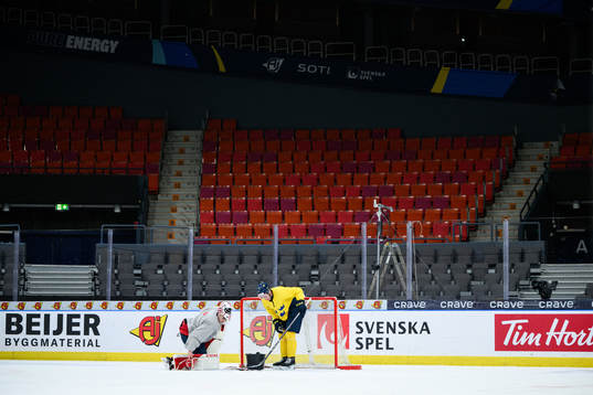 goaltender Kevin Reidler and Elias Salomonsson of Sweden at
