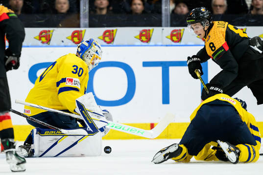 Goaltender Melker Thelin of Sweden and Julian Lutz of