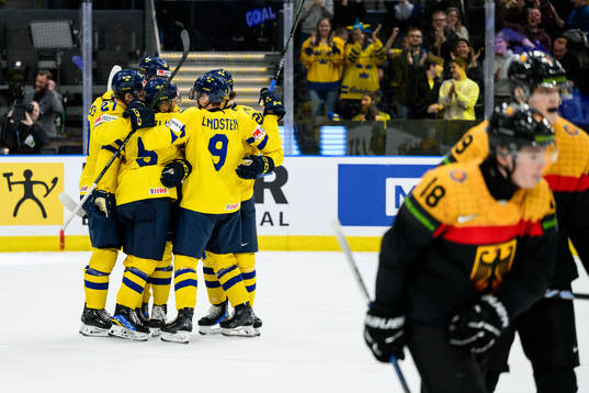 Players of Sweden celebrate with Mattias Hävelid