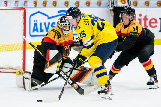 Otto Stenberg of Sweden against Goaltender Matthias Bittner