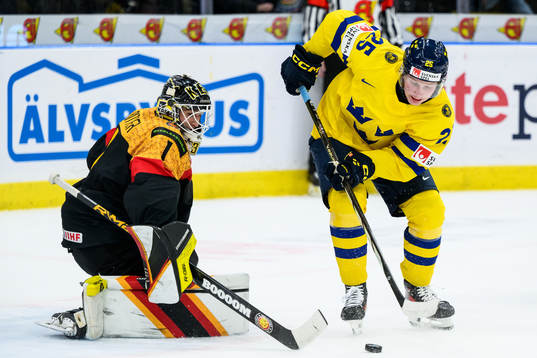 Goaltender Matthias Bittner of Germany and Otto Stenberg of