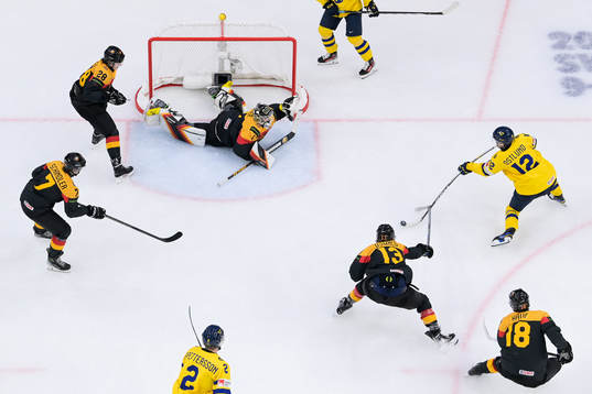 goaltender Matthias Bittner of Germany and Noah Östlund of