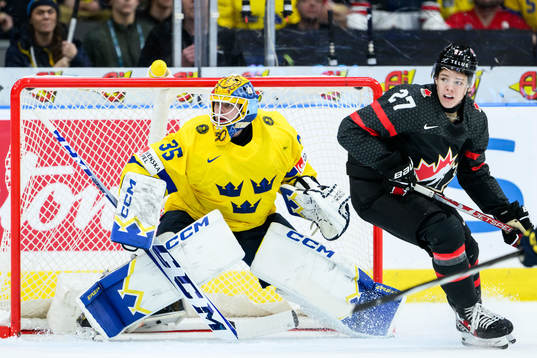 Goaltender Hugo Hävelid of Sweden and Easton Cowan of