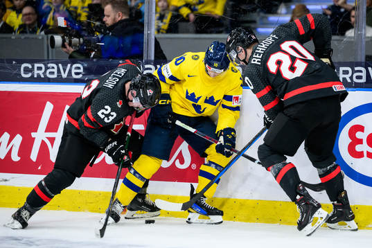 Ty Nelson and Carson Rehkopf of Canada and Fabian Wagner of