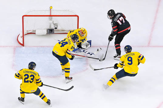 Macklin Celebrini of Canada against goaltender Hugo