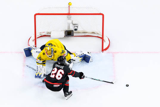goaltender Hugo Hävelid of Sweden and Matthew Savoie of