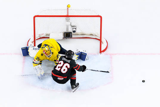 goaltender Hugo Hävelid of Sweden and Matthew Savoie of