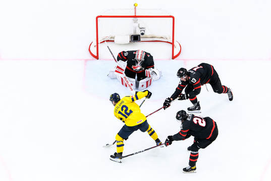 Noah Östlund of Sweden against goalkeeper Mathis Rousseau,