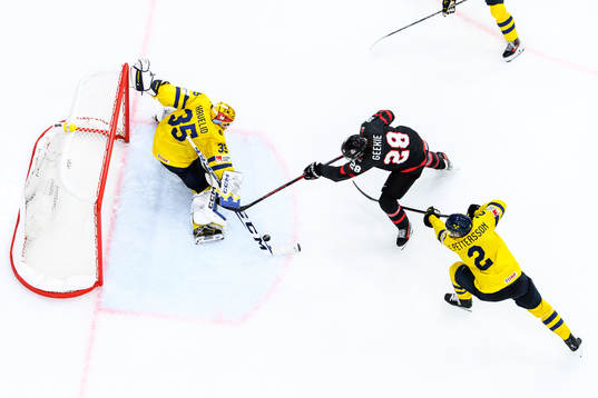 goaltender Hugo Hävelid and Elias Pettersson of Sweden