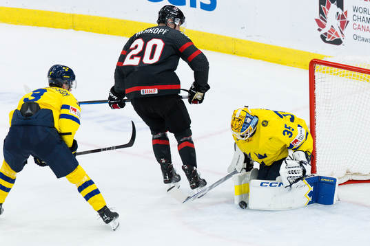 Carson Rehkopf of Canada against goaltender Hugo Hävelid