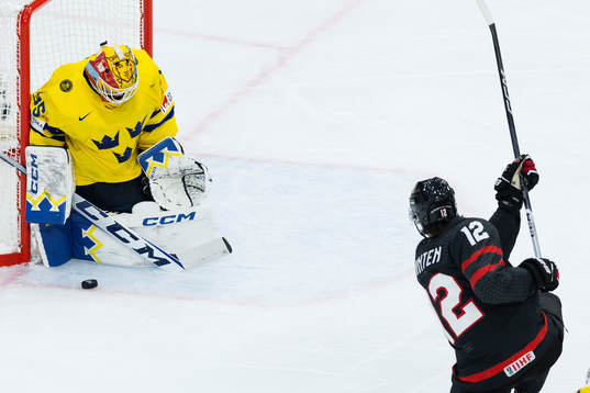 Goaltender Hugo Hävelid of Sweden and Fraser Minten of