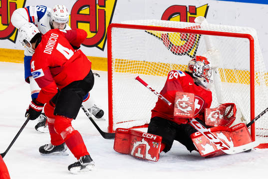 Patrik Dalen of Norway scores 1-2 behind goaltender Alessio