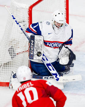 Goaltender Markus Stensrud saves a shot from Jonas Taibel