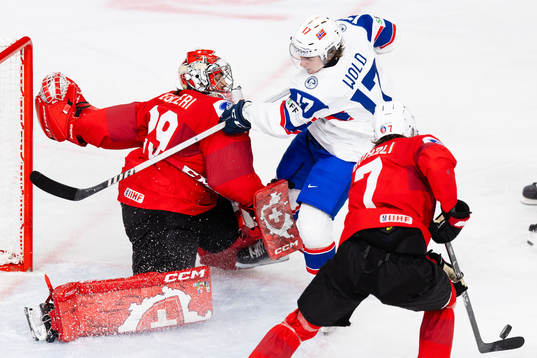 Goaltender Alessio Begleri of Switzerland and Sander Wold