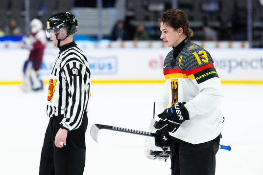 Veit Oswald of Germany leaves the ice