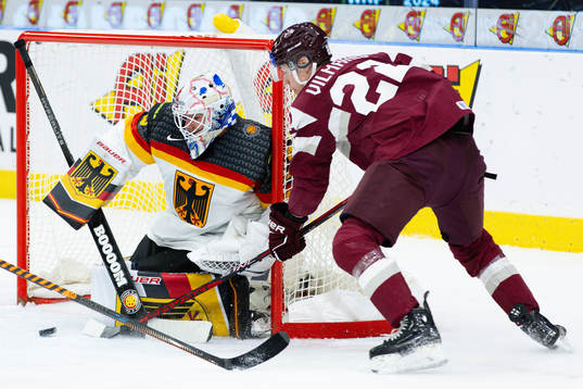 Goaltender Philipp Dietl of Germany and Sandis Vilmanis of