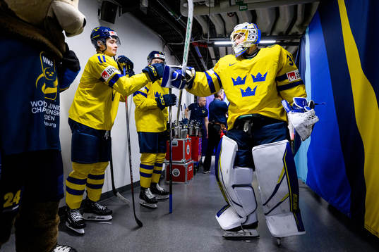 Isac Born and goaltender Melker Thelin of Sweden