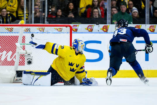 Goaltender Melker Thelin of Sweden and Jani Nyman of Finland