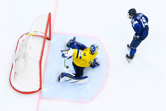 goaltender Melker Thelin of Sweden and Konsta Helenius of