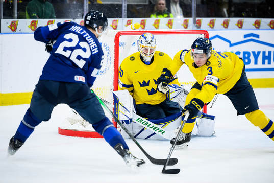goaltender Melker Thelin and Elias Salomonsson of Sweden